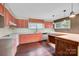 Updated kitchen with a large sink, modern appliances, and custom bar at 37156 Southside Rd, Albemarle, NC 28001