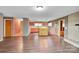 Bright and spacious living room with a custom bar, fireplace, and natural light at 37156 Southside Rd, Albemarle, NC 28001