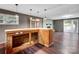 Open concept living space with custom bar and wood-burning fireplace at 37156 Southside Rd, Albemarle, NC 28001