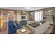 Virtual staging shows large living room with fireplace and ample seating at 37156 Southside Rd, Albemarle, NC 28001