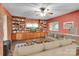 Digitally staged: Charming living room with custom shelving, comfortable seating, and hardwood flooring at 37156 Southside Rd, Albemarle, NC 28001