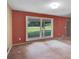 Bright living room featuring a large window overlooking a green lawn at 37156 Southside Rd, Albemarle, NC 28001