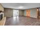 Large living area with brick fireplace and sliding glass door to deck at 37156 Southside Rd, Albemarle, NC 28001