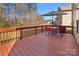 Outdoor deck with stained wood, patio furniture, and umbrella perfect for relaxation and entertaining at 3735 Ernie Dr, Charlotte, NC 28269