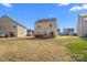 Spacious backyard with a patio, lawn, and neighboring homes, perfect for outdoor activities at 3735 Ernie Dr, Charlotte, NC 28269