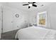 Inviting bedroom with a ceiling fan, featuring natural light and a cozy workspace by the window at 3735 Ernie Dr, Charlotte, NC 28269