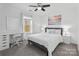 Bright bedroom offering a dedicated desk area, ample natural light, and a modern ceiling fan at 3735 Ernie Dr, Charlotte, NC 28269