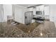 Updated kitchen featuring granite counters, stainless steel appliances, and bright white cabinets at 3735 Ernie Dr, Charlotte, NC 28269