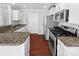 Well-equipped kitchen featuring granite countertops, stainless steel appliances, and modern fixtures at 3735 Ernie Dr, Charlotte, NC 28269