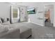 Bright living room with a comfortable gray sofa and modern decor creates a welcoming space at 3735 Ernie Dr, Charlotte, NC 28269