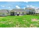 View of a well-maintained backyard with a patio, grill, and screened-in porch, great for outdoor enjoyment at 385 Willow Tree Dr, Rock Hill, SC 29732