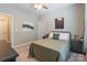 Neutral colored bedroom features a comfortable bed, a ceiling fan, and carpeted floors at 385 Willow Tree Dr, Rock Hill, SC 29732