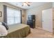 Comfortable bedroom with a ceiling fan, natural light, and a dresser with a TV at 385 Willow Tree Dr, Rock Hill, SC 29732