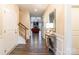 Elegant foyer featuring hardwood floors, staircase, and view into the living room at 385 Willow Tree Dr, Rock Hill, SC 29732