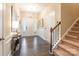 Bright and spacious foyer with hardwood flooring, staircase, and stylish decor at 385 Willow Tree Dr, Rock Hill, SC 29732