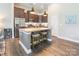 Charming kitchen featuring stainless steel appliances, granite counters, and a spacious center island with seating at 385 Willow Tree Dr, Rock Hill, SC 29732