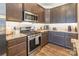 A well-equipped kitchen with stainless steel appliances, granite countertops, and ample cabinet space for storage at 385 Willow Tree Dr, Rock Hill, SC 29732