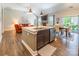 A kitchen island overlooks the living and dining areas, enhancing the open floor plan at 385 Willow Tree Dr, Rock Hill, SC 29732