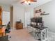 Well-lit home office with multiple work areas, neutral tones, and carpeted floors at 385 Willow Tree Dr, Rock Hill, SC 29732