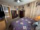 Inviting bedroom with a queen-sized bed, warm lighting, and unique decor at 4059 10Th Avenue Sw Dr, Hickory, NC 28602