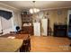 Dining area with a traditional chandelier, wooden furniture, and a cozy atmosphere at 4059 10Th Avenue Sw Dr, Hickory, NC 28602