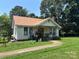 Charming home with a manicured lawn and walkway leading to the front porch at 4059 10Th Avenue Sw Dr, Hickory, NC 28602