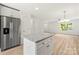 Spacious kitchen with a granite island that opens to the living room and stainless steel appliances at 443 Faith Sw Dr, Concord, NC 28027