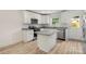 Modern kitchen with granite countertops, stainless steel appliances, and a kitchen island at 443 Faith Sw Dr, Concord, NC 28027