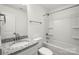 Cozy bathroom with granite counters, white cabinets, and a shower-tub combo at 445 Faith Sw Dr, Concord, NC 28027