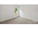 Bedroom with natural light and carpet at 445 Faith Sw Dr, Concord, NC 28027
