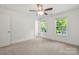Bright bedroom with carpet, two windows and a ceiling fan at 445 Faith Sw Dr, Concord, NC 28027