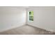 Neutral bedroom with window and carpet at 445 Faith Sw Dr, Concord, NC 28027