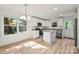 Modern kitchen with white cabinets, stainless steel appliances, and granite countertops at 445 Faith Sw Dr, Concord, NC 28027