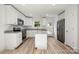 Modern kitchen with white cabinets, granite countertops, stainless steel appliances at 445 Faith Sw Dr, Concord, NC 28027