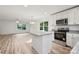 Modern kitchen with white cabinets, stainless steel appliances, and granite countertops at 445 Faith Sw Dr, Concord, NC 28027