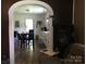 View of kitchen with white cabinets and dining table and chairs at 448 Belk St, Lancaster, SC 29720