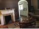 View from the living room looking into the kitchen with a fireplace at 448 Belk St, Lancaster, SC 29720