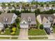 Beautiful aerial view of a two-story home featuring a two car garage, and a lush landscaped lawn at 5238 Prosperity View Dr, Charlotte, NC 28269