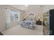 Comfortable bedroom with plush carpet, neutral tones, and soft natural light at 5238 Prosperity View Dr, Charlotte, NC 28269