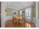 Elegant dining room featuring hardwood floors, a chandelier, and ample natural light at 5238 Prosperity View Dr, Charlotte, NC 28269