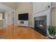Bright living room features hardwood floors, a fireplace, and neutral paint at 5238 Prosperity View Dr, Charlotte, NC 28269