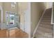 Inviting foyer with hardwood floors, a staircase, and plenty of natural light at 5238 Prosperity View Dr, Charlotte, NC 28269