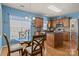 Eat in kitchen featuring custom wood cabinets, stainless steel appliances, and a breakfast nook at 5238 Prosperity View Dr, Charlotte, NC 28269