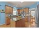 Charming kitchen boasts granite countertops, stainless steel appliances, and a stylish island at 5238 Prosperity View Dr, Charlotte, NC 28269