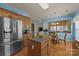 Open kitchen and breakfast nook featuring stainless steel appliances and granite countertop island at 5238 Prosperity View Dr, Charlotte, NC 28269