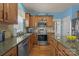 Well-equipped kitchen featuring stainless steel appliances, granite counters, and ample cabinet space at 5238 Prosperity View Dr, Charlotte, NC 28269
