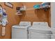 Efficient laundry area with a modern washer and dryer set and ample storage space at 5238 Prosperity View Dr, Charlotte, NC 28269