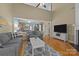 Open living room boasts hardwood floors, neutral paint, and a view into the adjacent kitchen at 5238 Prosperity View Dr, Charlotte, NC 28269