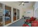 Cozy sunroom with comfortable seating and access to the living room and outdoor space at 5238 Prosperity View Dr, Charlotte, NC 28269