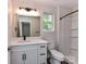 Refreshed bathroom featuring modern vanity, fixtures, and a shower-tub combination at 5306 Lee Massey Rd, Waxhaw, NC 28173